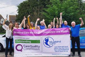 Bluebird Care Mid Essex celebrating their Outstanding review